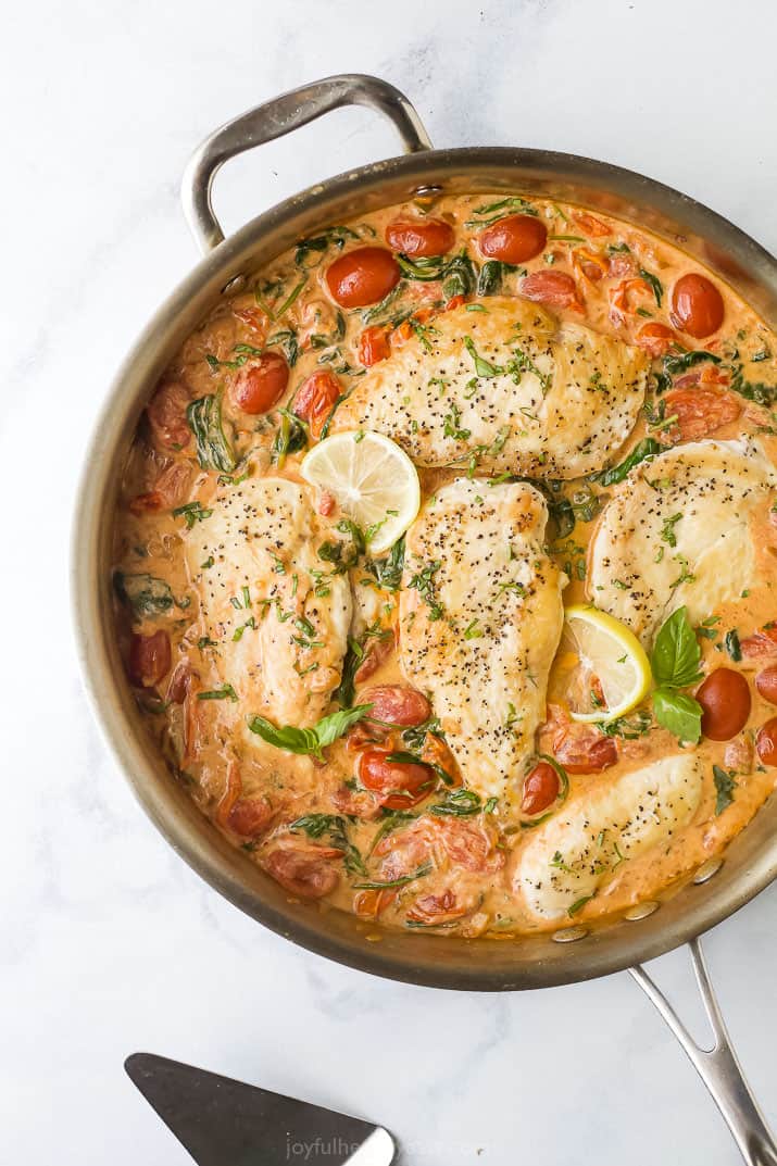 overhead photo of easy 30 minute creamy tuscan chicken in a pan