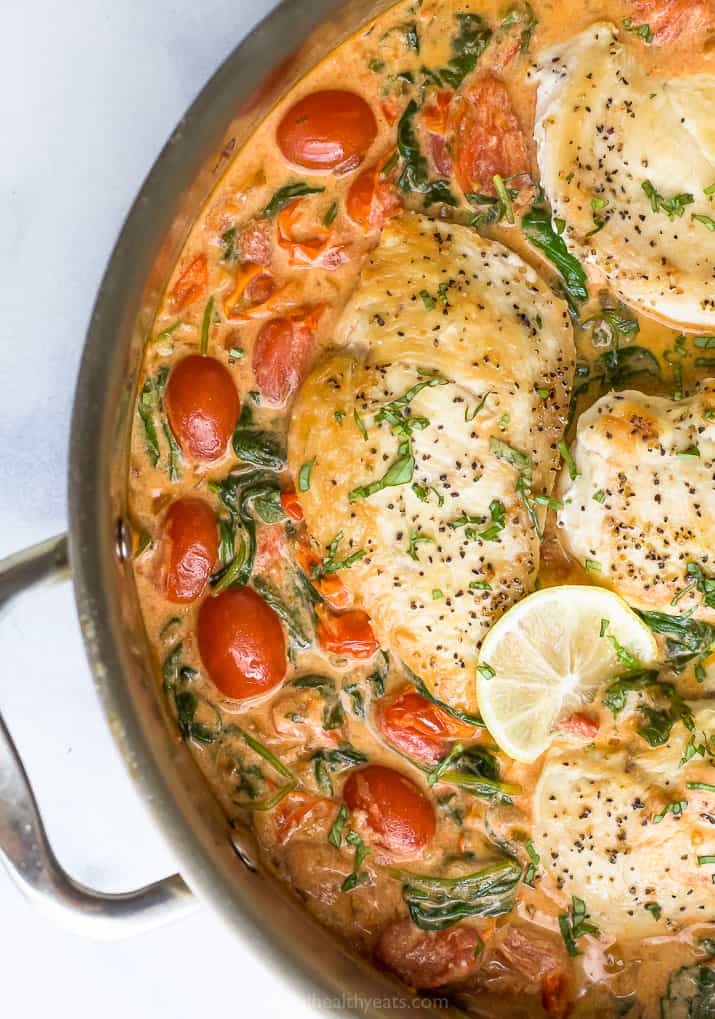 close up photo of easy 30 minute creamy tuscan chicken in a pan