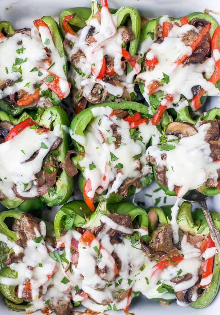 overhead view of easy keto philly cheesesteak stuffed peppers in a baking dish