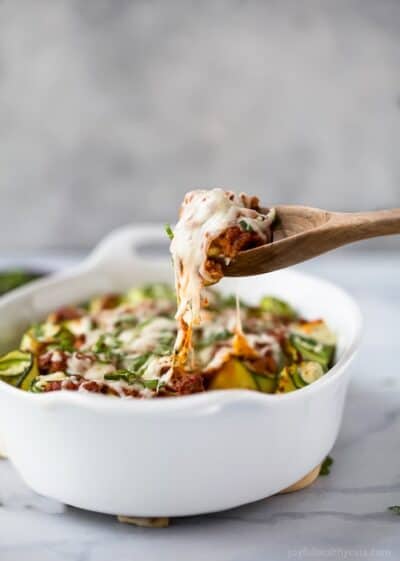 low carb zucchini lasagna roll ups in a baking sheet