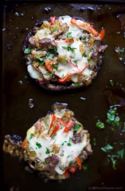 philly cheese steak stuffed mushrooms on a baking sheet