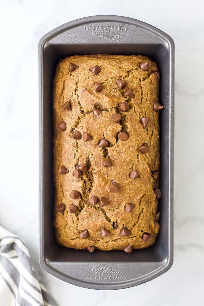 healthy banana pumpkin bread with chocolate chips in a loaf pan