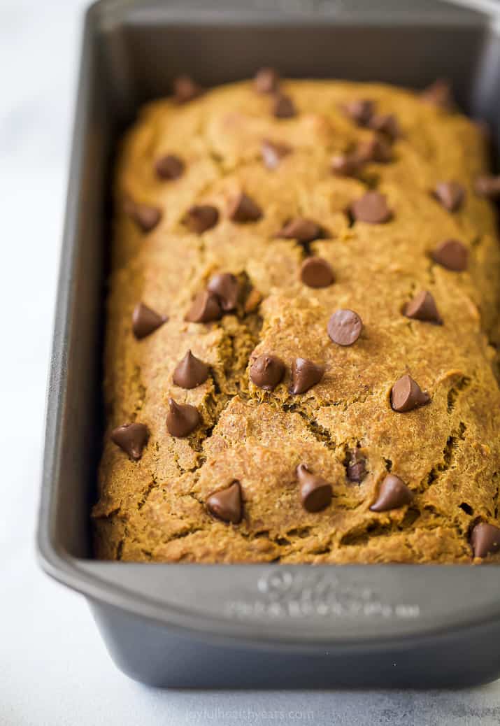 close up photo of healthy banana pumpkin bread with chocolate chips in a loaf pan