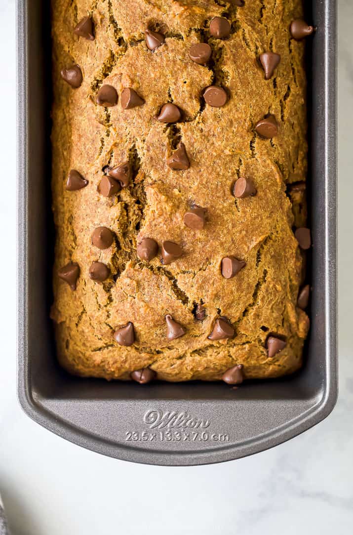 healthy banana pumpkin bread with chocolate chips in a loaf pan