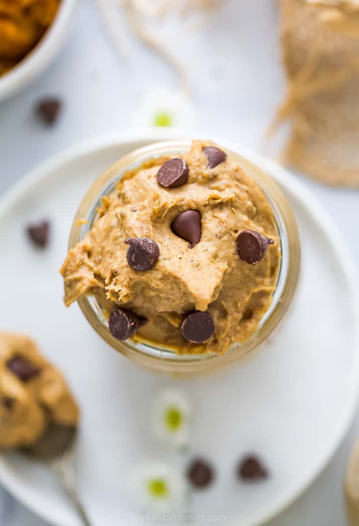 overhead photo of healthy vegan chocolate chip pumpkin cookie dough in a jar