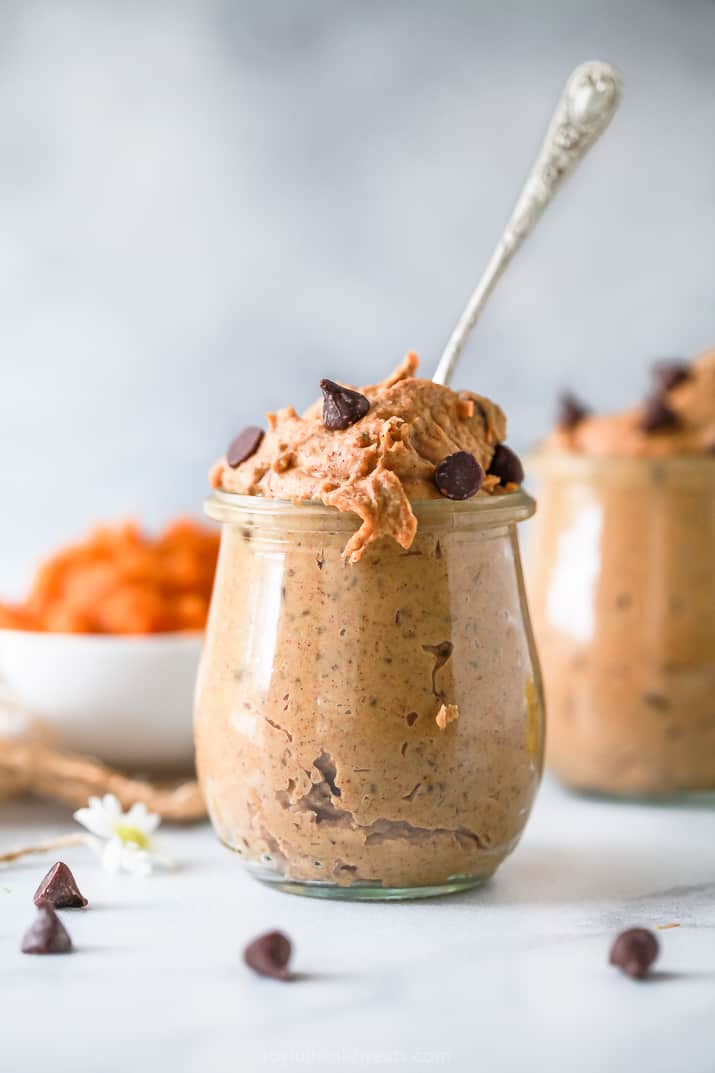 healthy vegan chocolate chip pumpkin cookie dough in a jar with a spoon