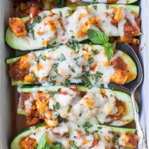 the best easy chicken parmesan zucchini boats in a baking dish