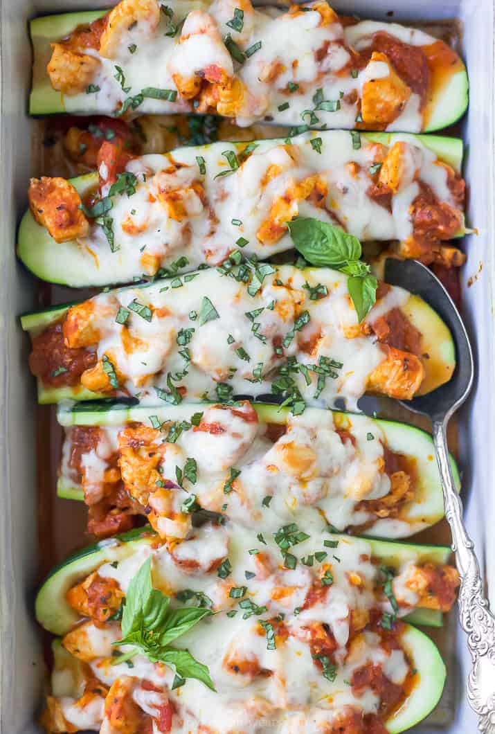 the best easy chicken parmesan zucchini boats in a baking dish