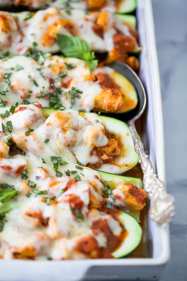 close up photo of the best easy chicken parmesan zucchini boats
