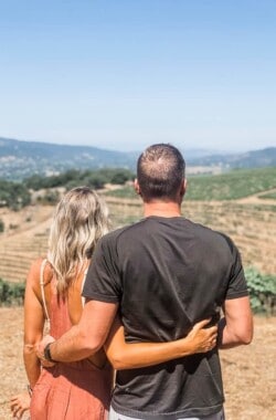 a couple overlooking a vineyard in Sonoma County