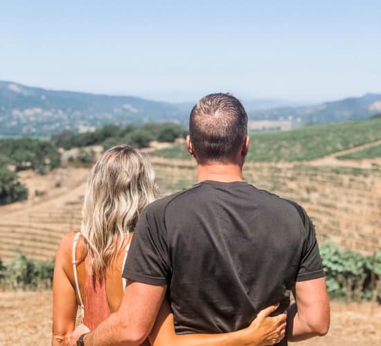 a couple overlooking a vineyard in Sonoma County