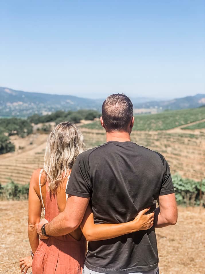 a couple overlooking a vineyard in Sonoma County