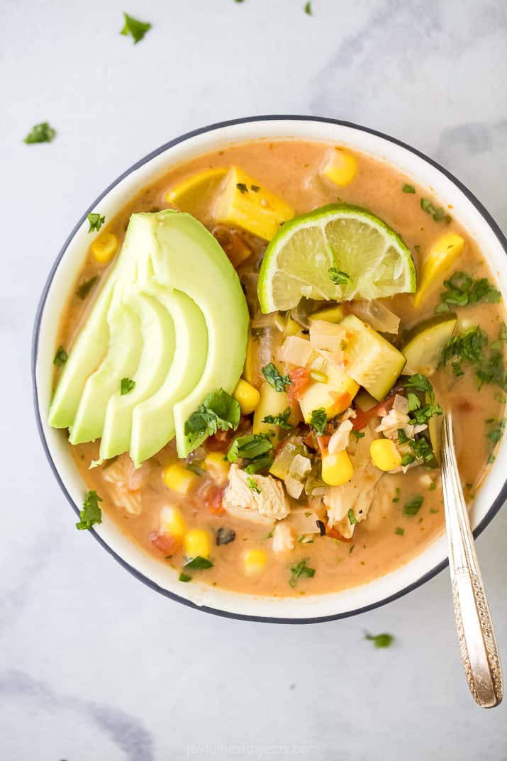 close up photo of the ultimate creamy crockpot chicken tortilla soup