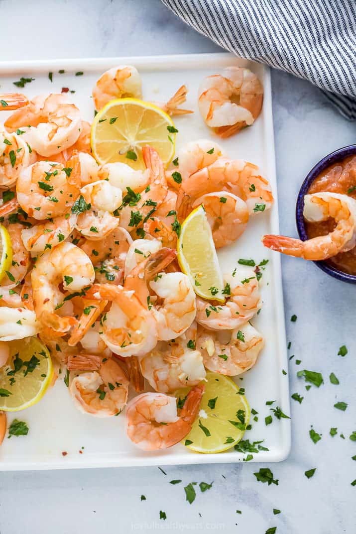 overhead photo of baked lemon garlic butter shrimp