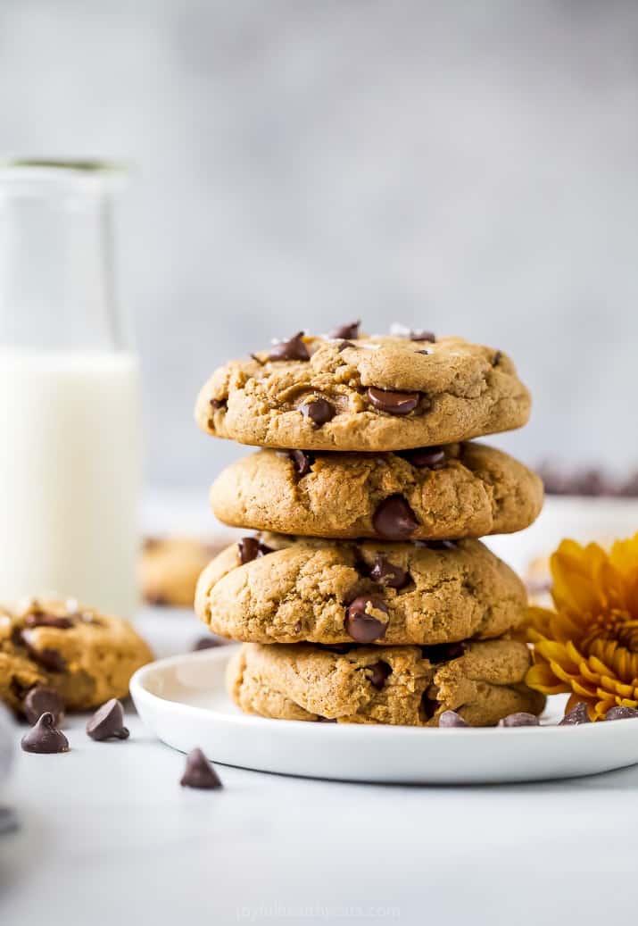 epic vegan pumpkin chocolate chip cookies stacked on top of each other