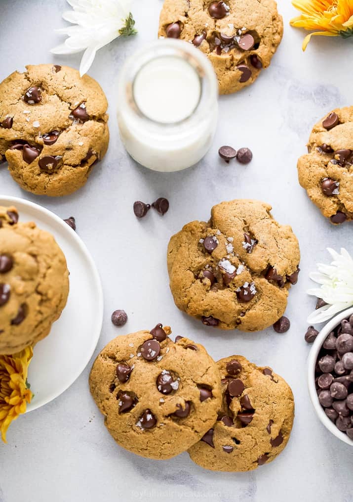 overhead photo of vegan pumpkin chocolate chip cookies with milk