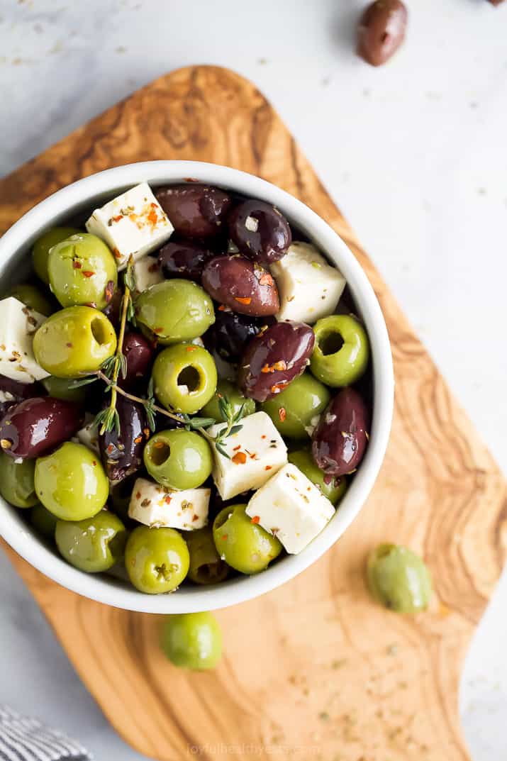 overhead photo of garlic marinated olives and feta cheese