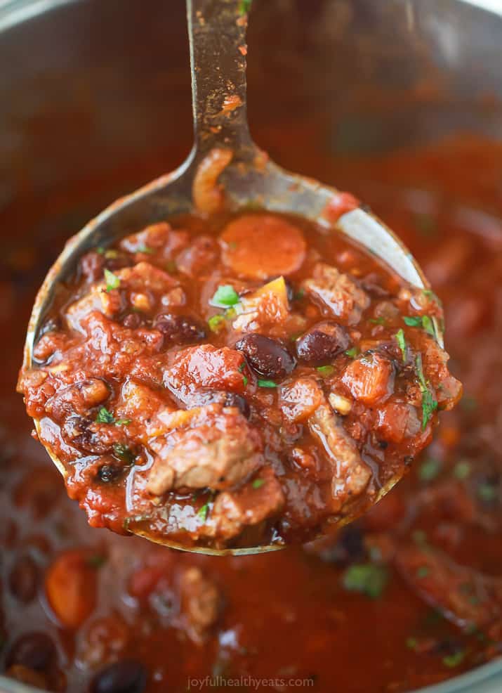 A ladle scooping the best instant pot chili.