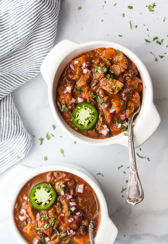 Overhead photo of the best instant pot chili recipe with steak in bowls.