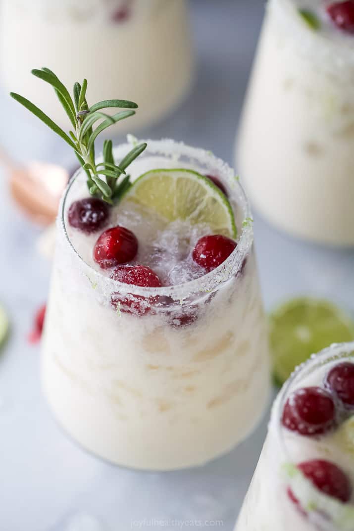 close up of white christmas margarita recipe in a glass and garnished