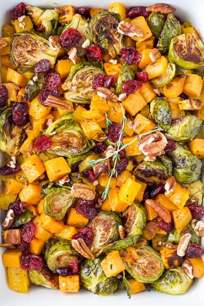 close up photo of maple dijon roasted butternut squash brussel sprout salad 