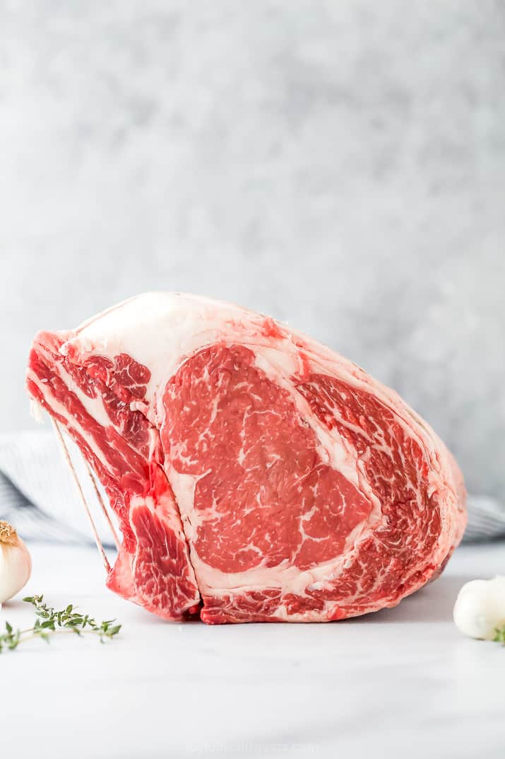 raw prime rib roast on a counter