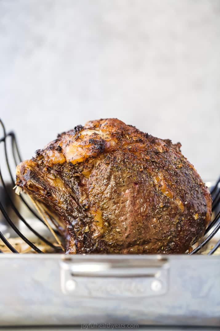 perfect garlic herb prime rib roast in a roasting pan