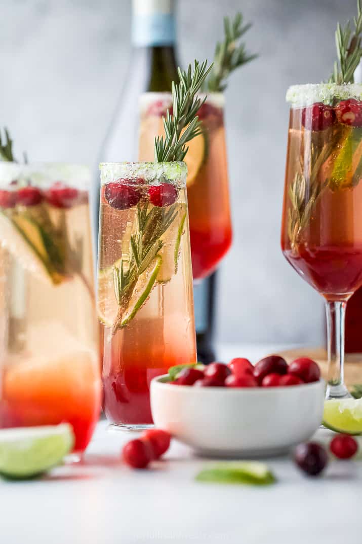 easy cranberry mimosa recipe in a glass with garnish