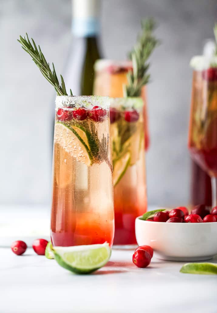 easy cranberry mimosa recipe in a glass with garnish