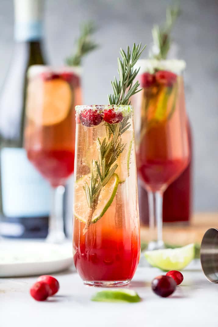 easy cranberry mimosa recipe in a glass with garnish