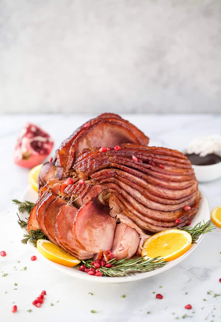 easy pomegranate maple glazed ham on a plate