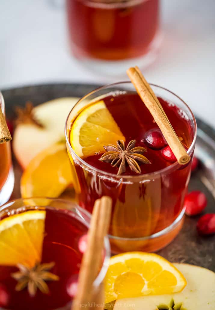 close up photo of festive spiked cranberry mulled apple cider 