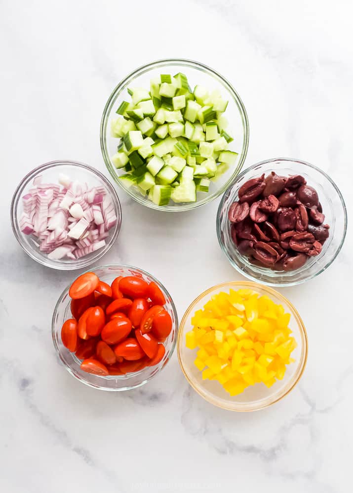 ingredients for easy greek chicken salad recipe in a mason jar