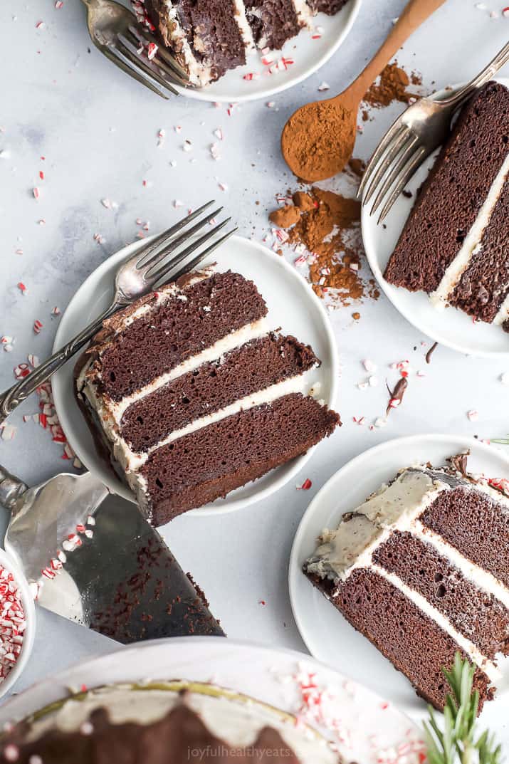 pieces of vegan chocolate cake with peppermint buttercream on plates