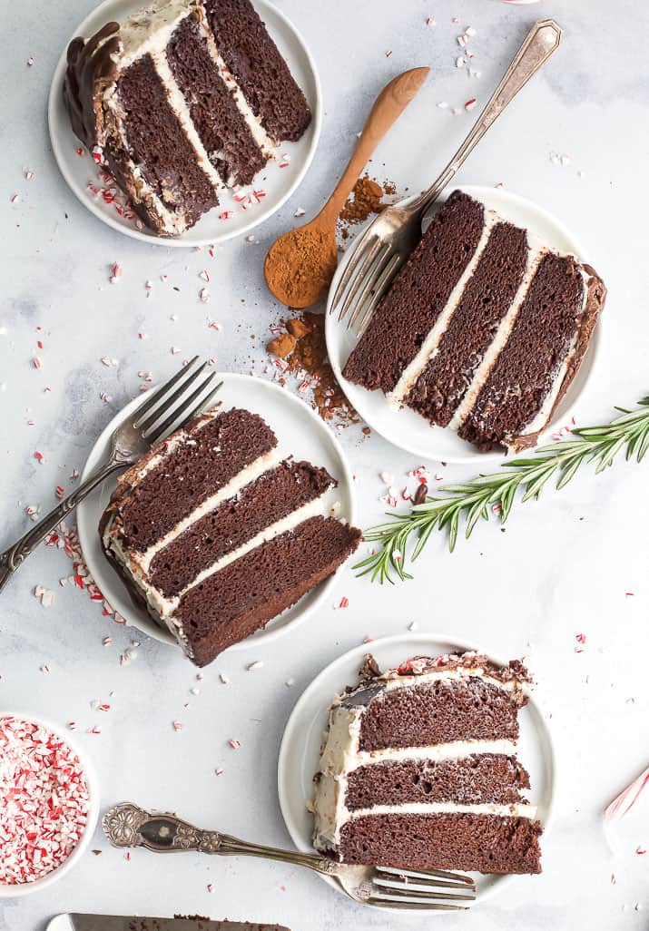 pieces of vegan chocolate cake with peppermint buttercream served on plates