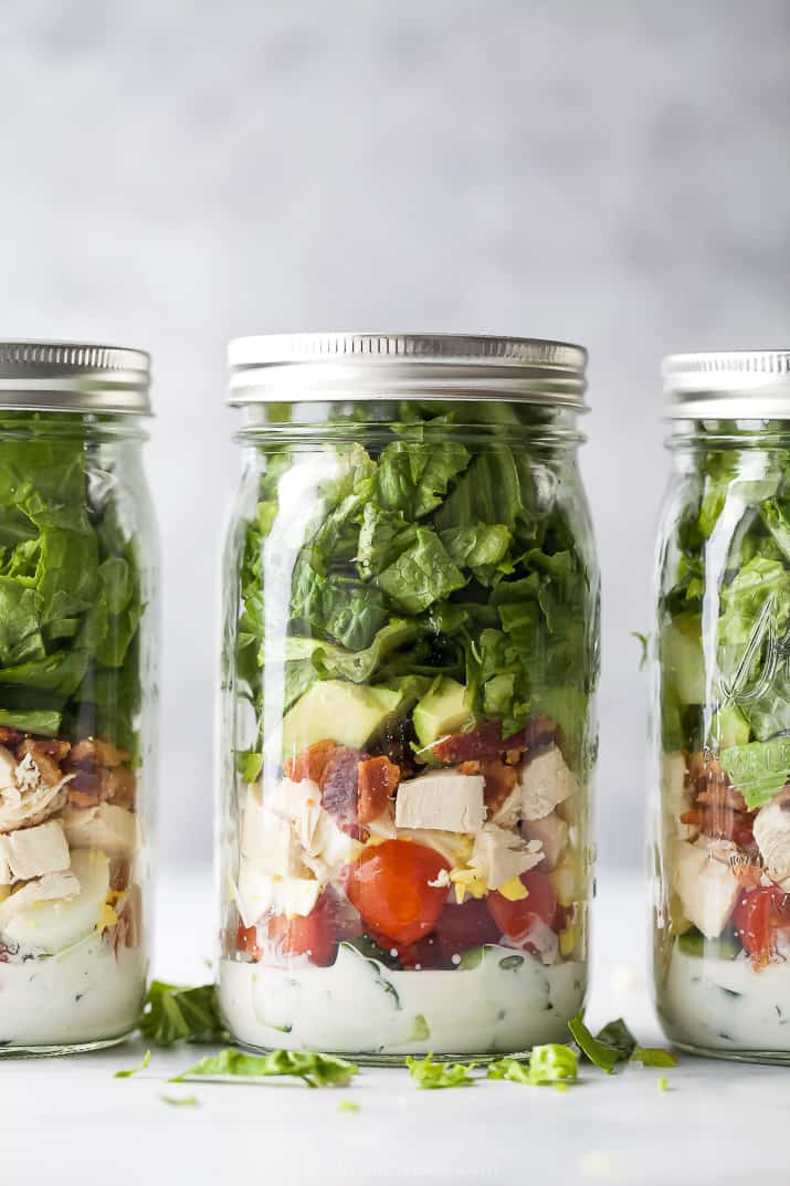 mason jars filled with chicken cobb salad recipe with ranch dressing