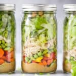 the best thai chicken mason jar salads with a spicy peanut dressing