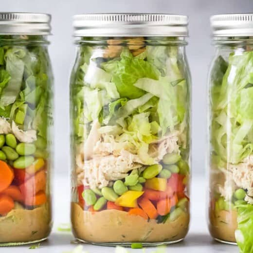 the best thai chicken mason jar salads with a spicy peanut dressing