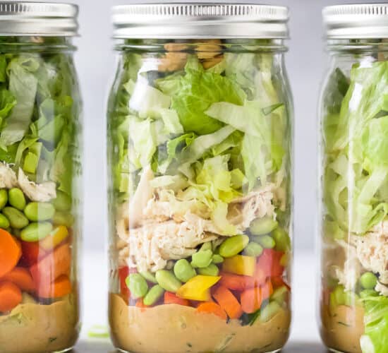 the best thai chicken mason jar salads with a spicy peanut dressing