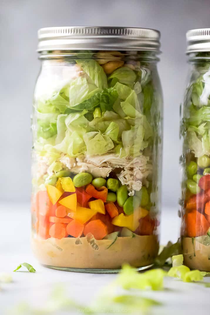 closeup of the best thai chicken mason jar salad recipe with spicy peanut dressing