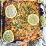 baked honey garlic salmon in foil with a fork