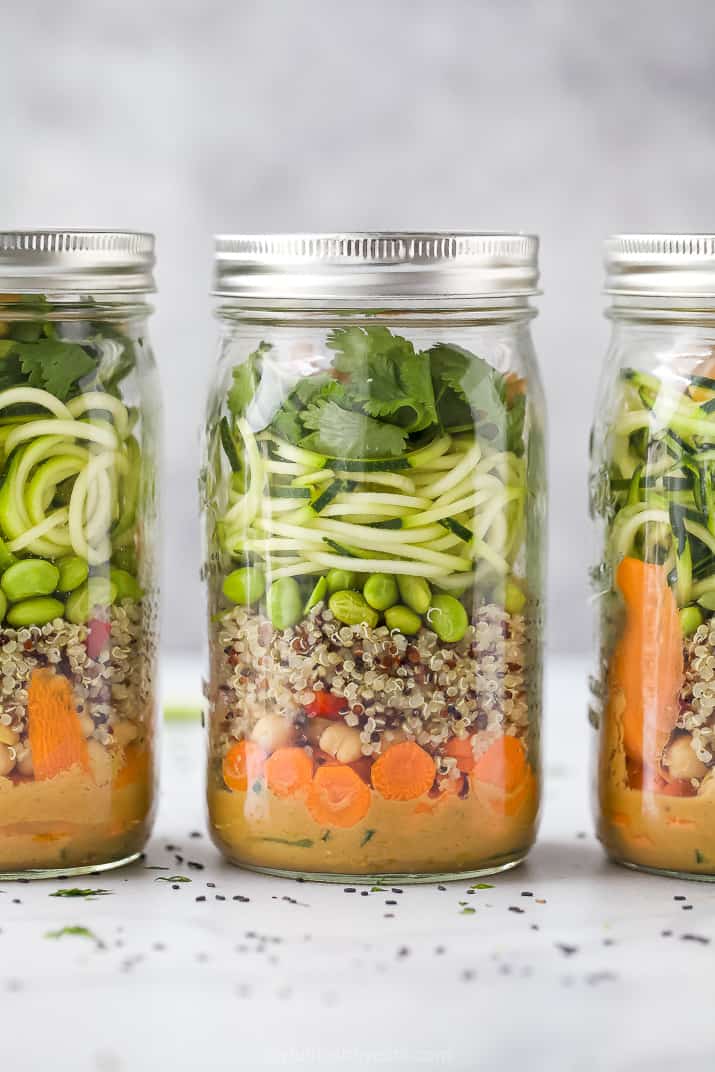 vegetarian thai quinoa salad with peanut dressing in a mason jar