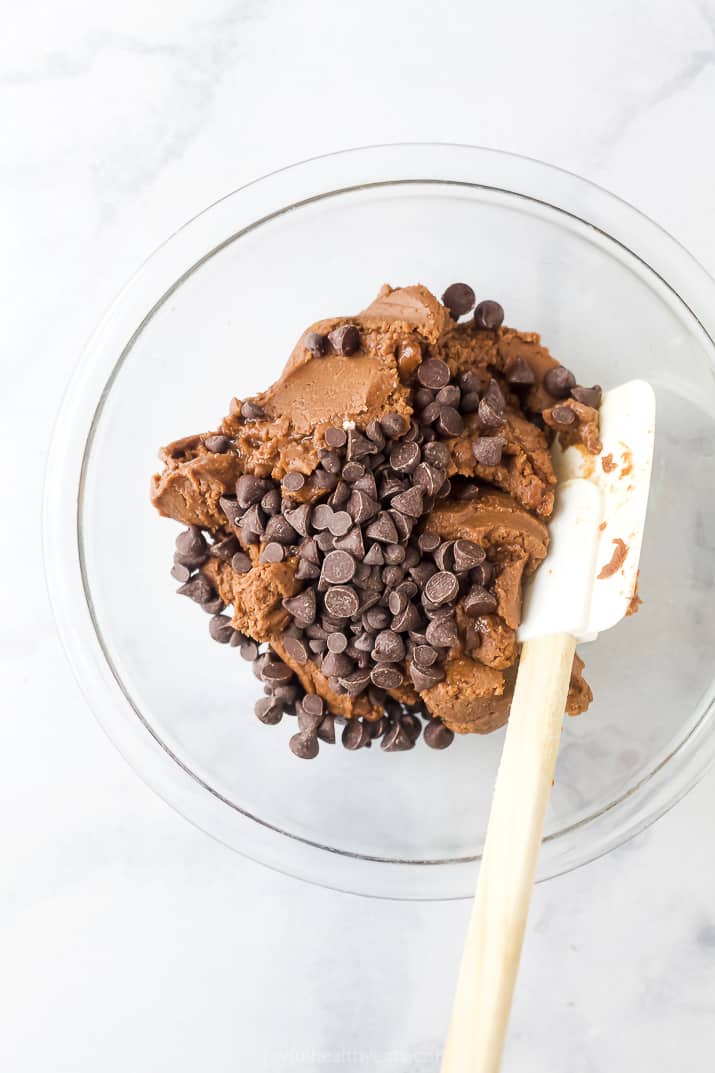 edible brownie batter in a bowl with chocolate chips