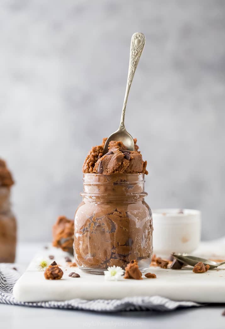 easy vegan edible brownie batter in a jar with a spoon