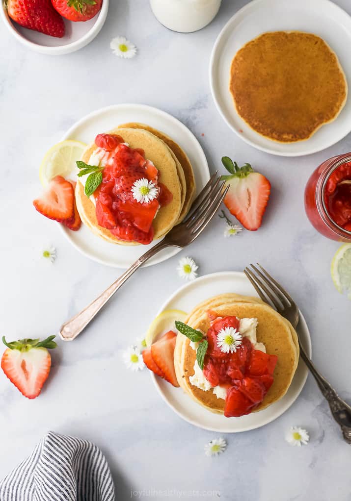 overhead photo of fluffy pancake recipe with strawberry compote with vanilla mascarpone cheese