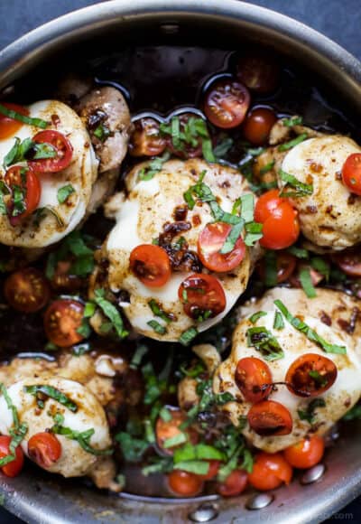 balsamic glazed caprese chicken in a skillet