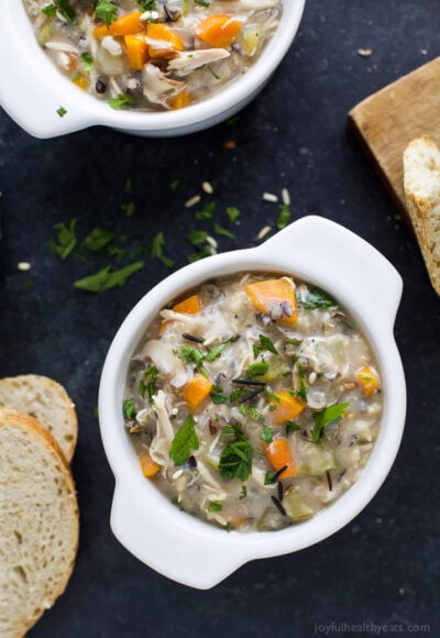 crock pot chicken and wild rice soup in a bowl with crunchy bread