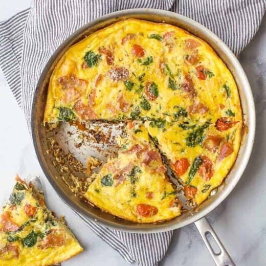 overhead photo of quick and easy prosciutto spinach frittata recipe in a pan