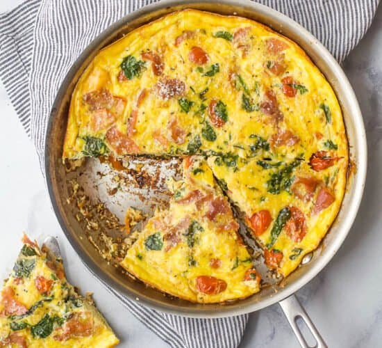 overhead photo of quick and easy prosciutto spinach frittata recipe in a pan