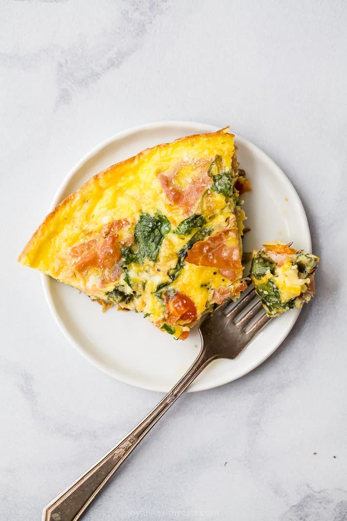 a plate with a slice of prosciutto spinach frittata recipe